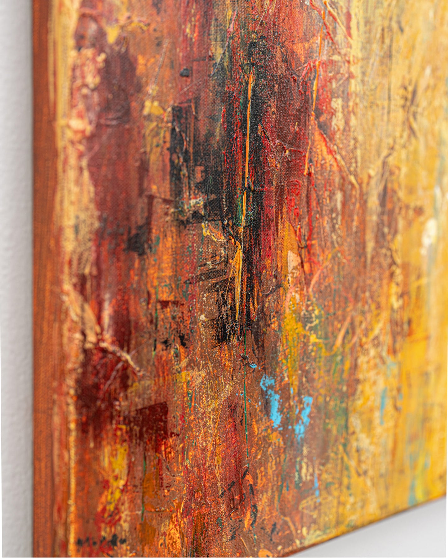 Abstract art with a textured surface featuring warm colors.