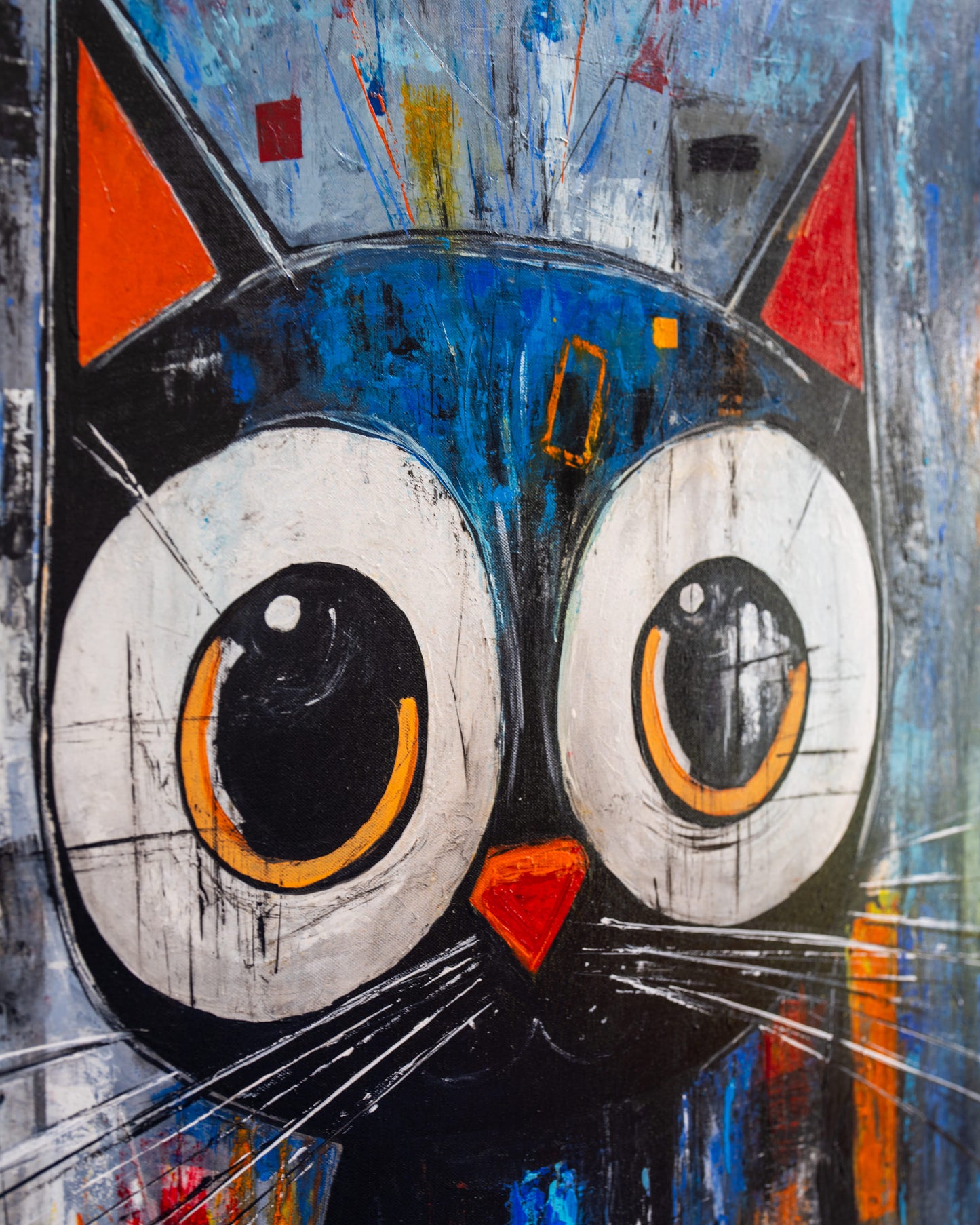 Abstract painting of a cat's face with large eyes and colorful background