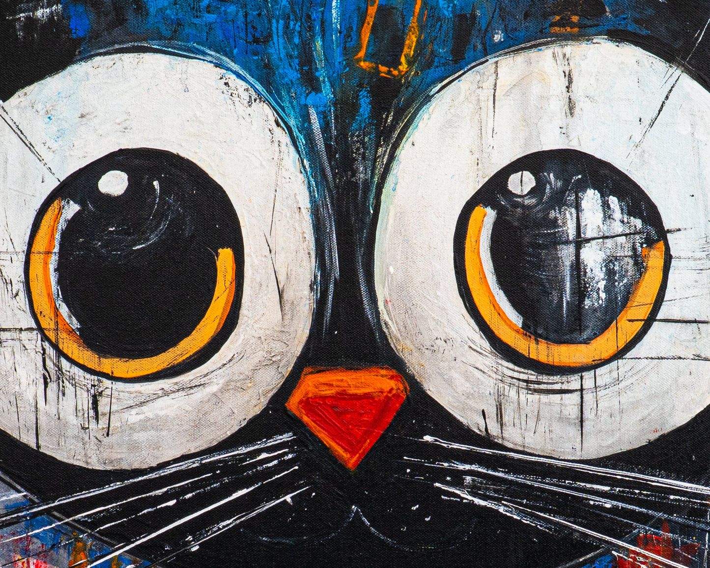 Close-up of a stylized cat face painting with large eyes and a red nose.