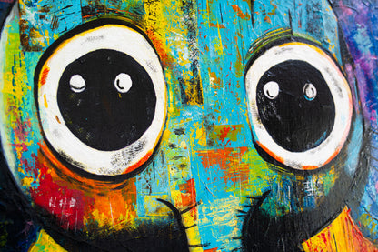 Abstract painting of a character with large eyes on a colorful background