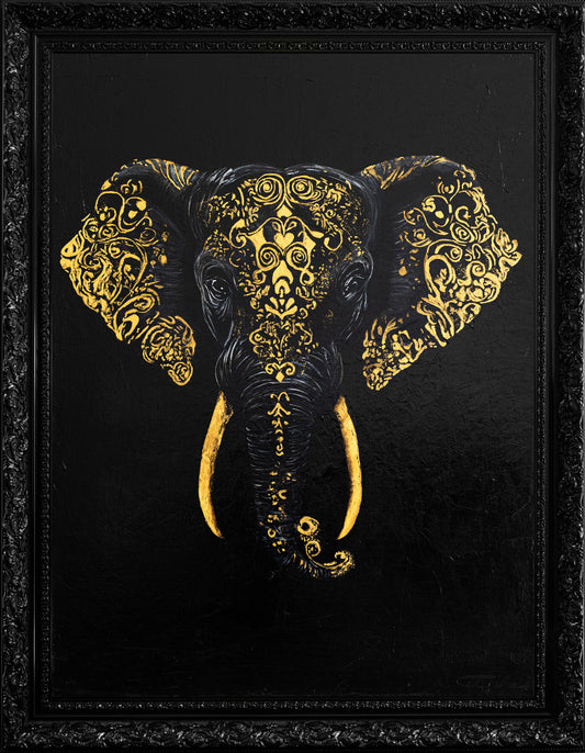 Decorative elephant head with gold patterns on a black background