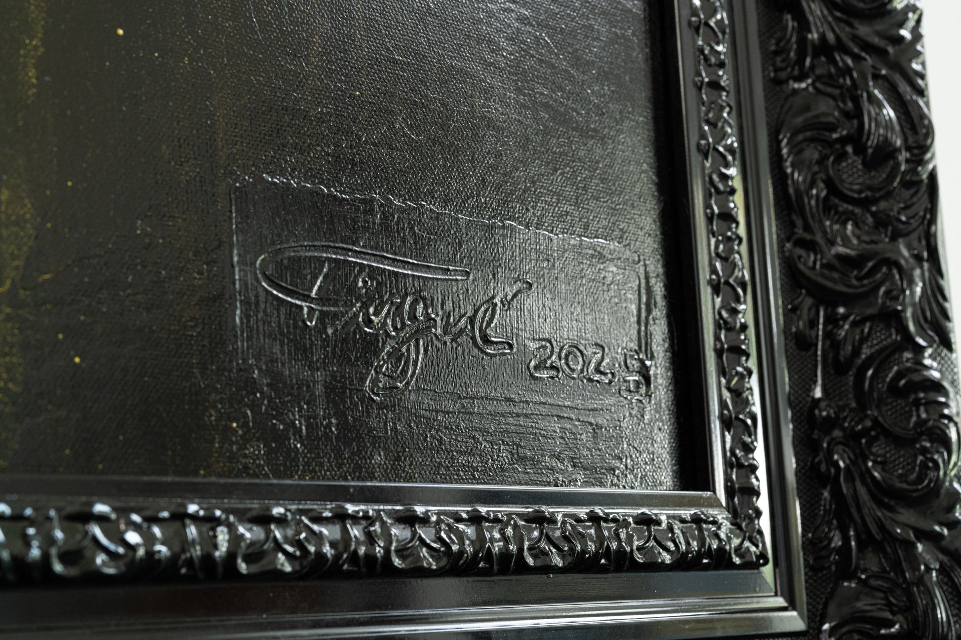 Decorative frame with a signature and date on a textured surface
